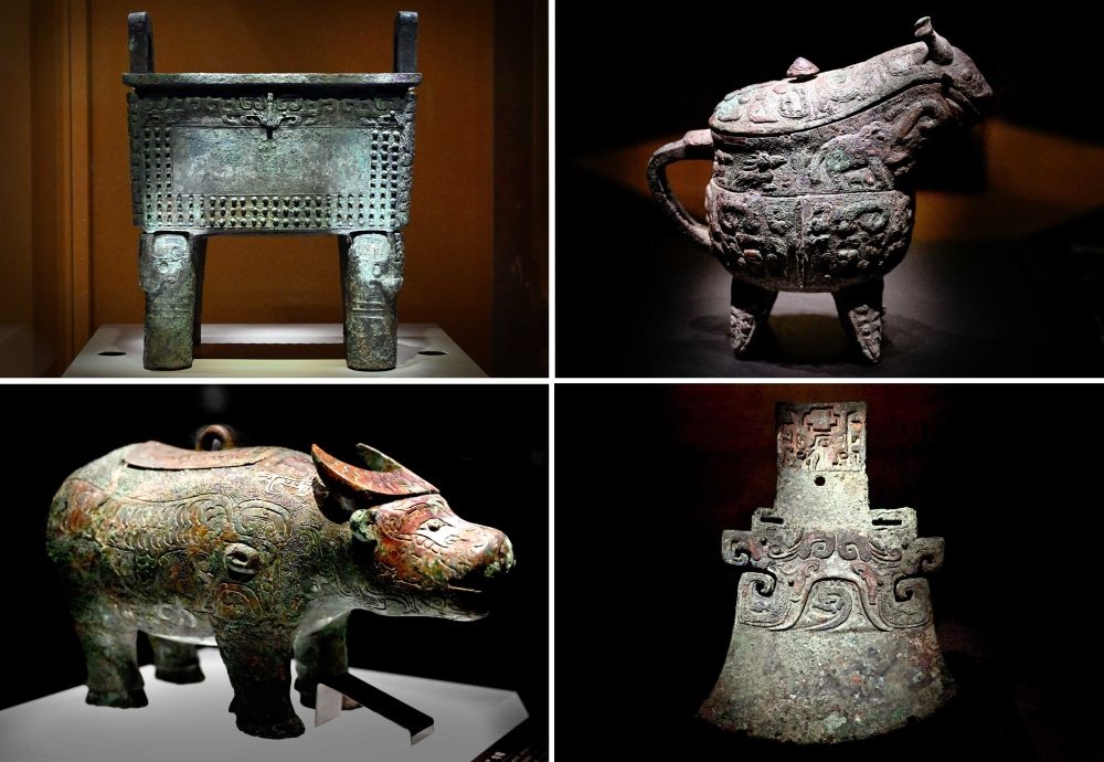 這是殷墟博物館新館內展出的“司母辛”銅鼎（左上）、“亞長”銅?。ㄓ疑希ⅰ皝嗛L”牛尊（左下）、“亞長”銅鉞（拼版照片，2月23日攝）。